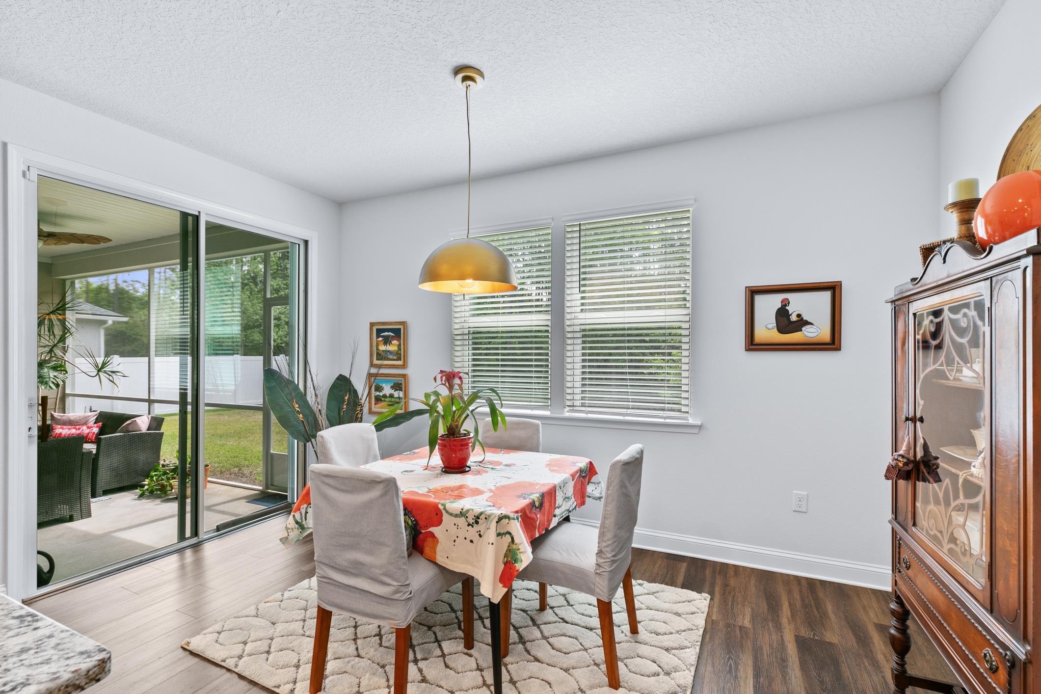 345 Downs Corner Road St. Augustine, FL 32092 - Photo 9 of 39 a view of a dining room with furniture window and wooden floor