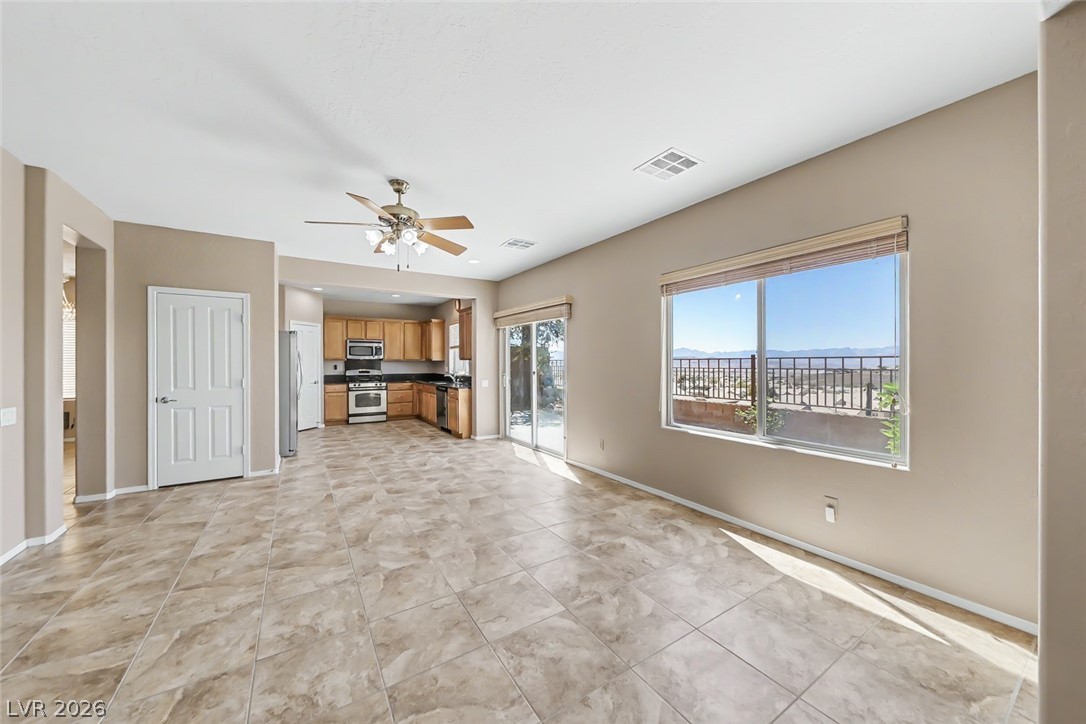 2356 Rue Bienville Way Henderson, NV 89044 - Photo 5 of 20 Bright, open-concept living area with a view, featuring a kitchen and ample floor space.