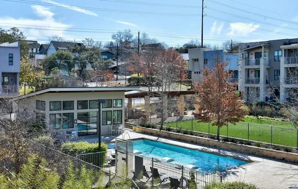 a backyard of a house with lots of green space and garden