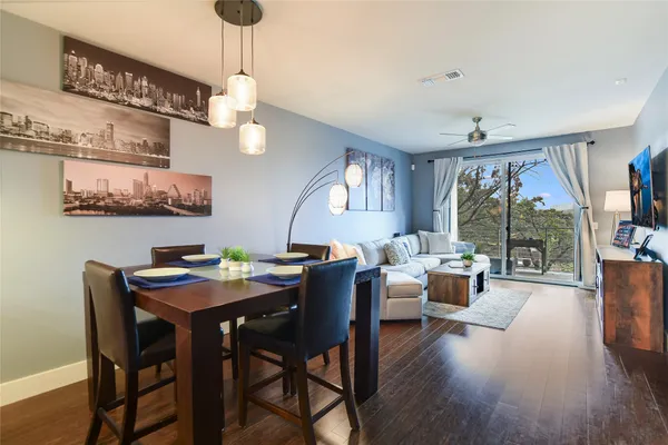a view of a dining room with furniture window and wooden floor