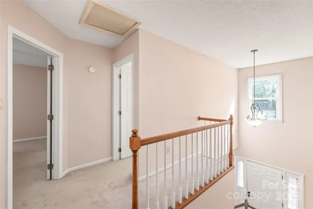 a bedroom with a bed dresser and a window