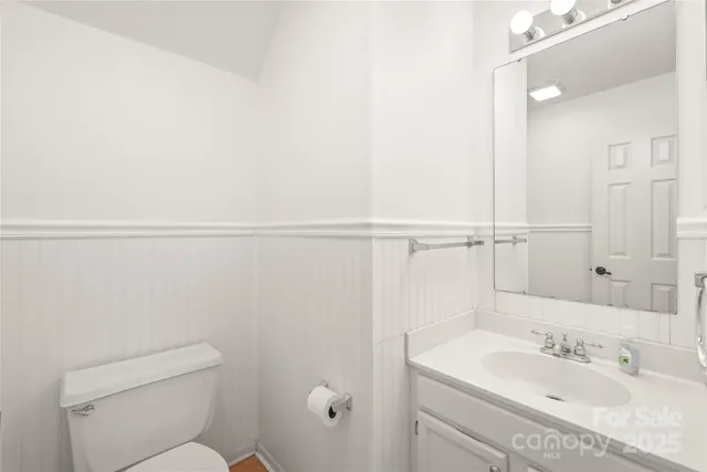 a balcony with wooden floor and fence