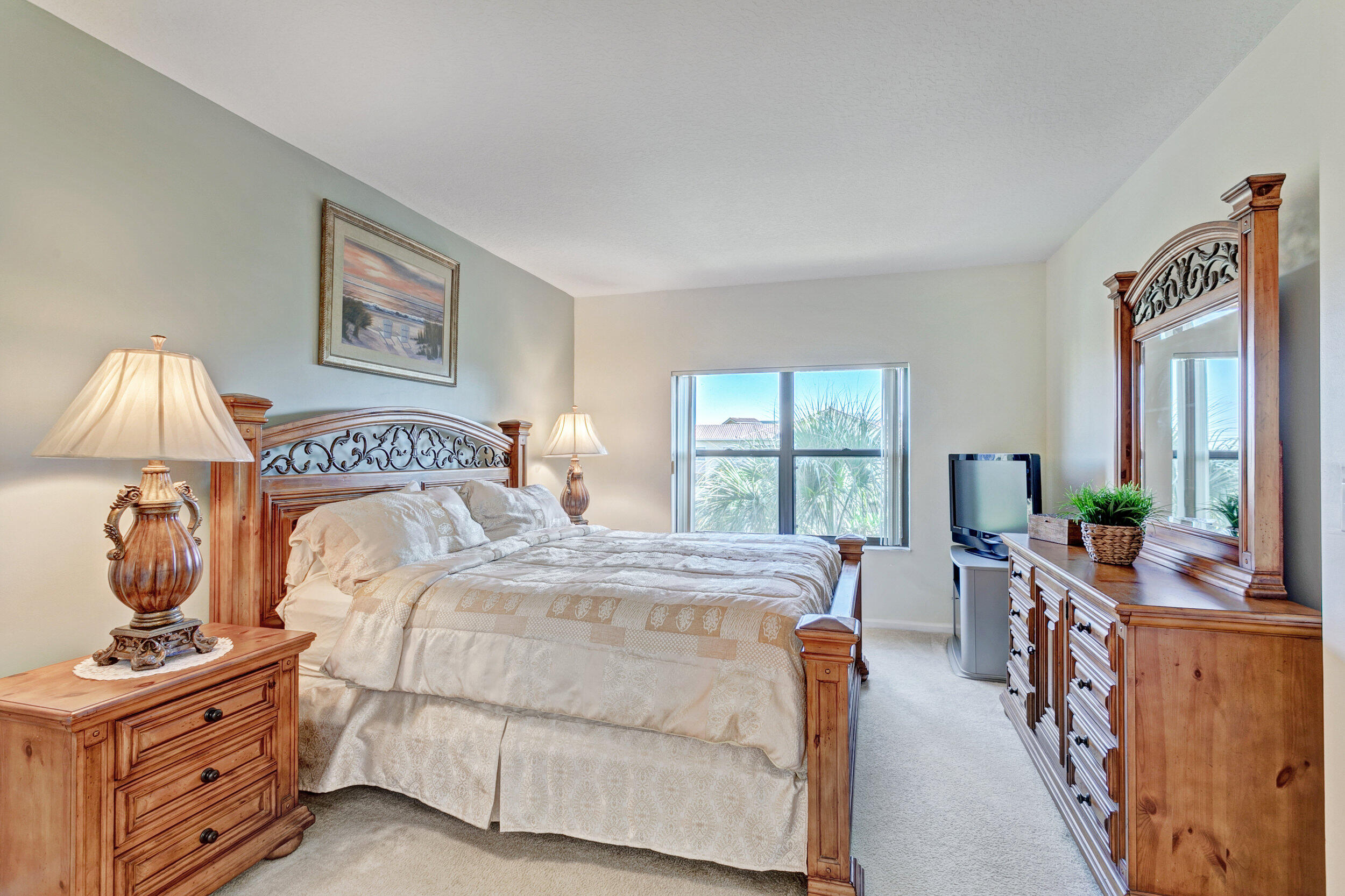 500 Uno Lago Drive, Unit 402 Juno Beach, FL 33408 - Photo 19 of 36 Primary Bedroom