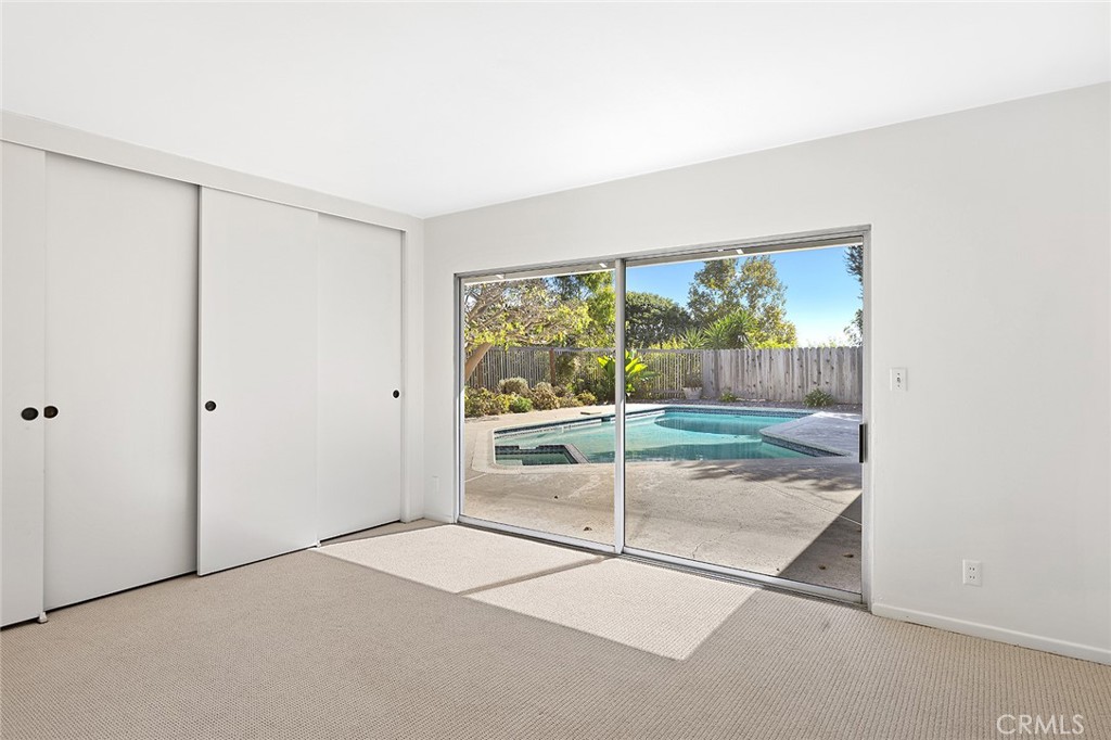 23 Monarch Bay Drive Dana Point, CA 92629 - Photo 17 of 45 an empty room with wooden floor and windows