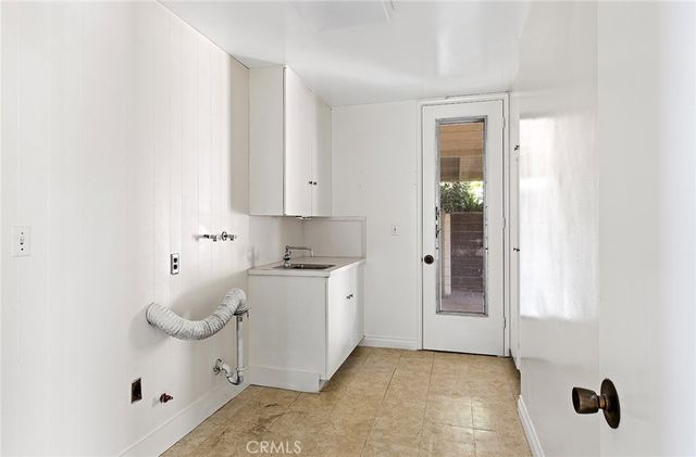 a spacious bathroom with a sink a toilet and shower