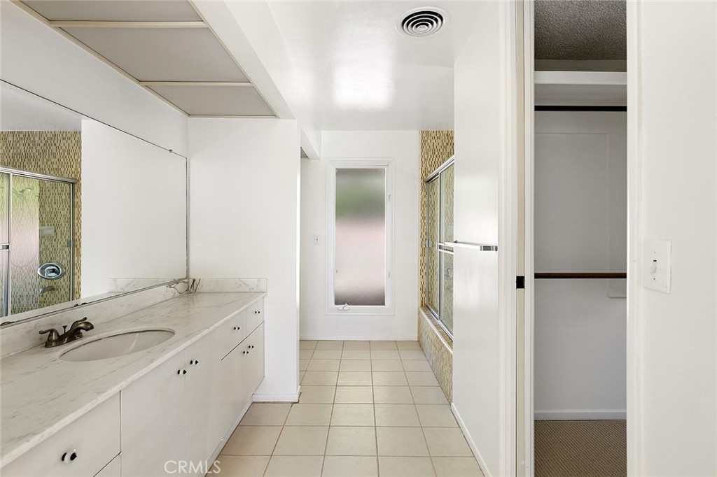 23 Monarch Bay Drive Dana Point, CA 92629 - Photo 26 of 45 a bathroom with a granite countertop sink mirror and a bathtub