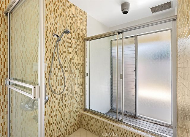 a view of a bathroom with a glass door