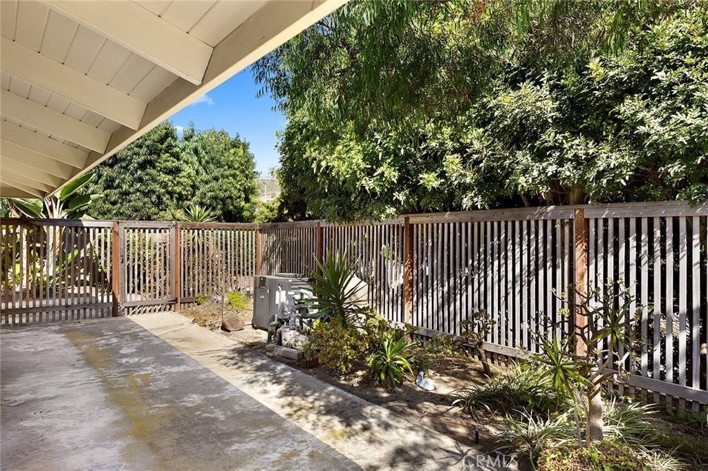 23 Monarch Bay Drive Dana Point, CA 92629 - Photo 40 of 45 a backyard with wooden fence and a bench