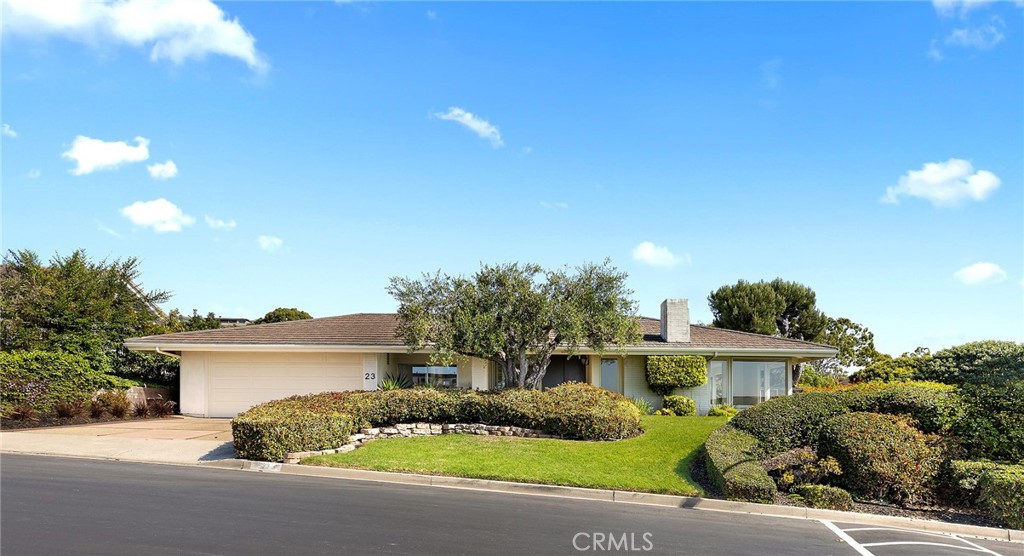 23 Monarch Bay Drive Dana Point, CA 92629 - Photo 4 of 45 a front view of a house with a garden
