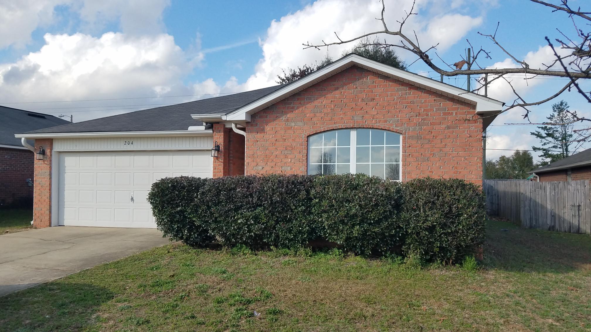 204 Limestone Circle Crestview, FL 32539 - Photo 1 of 19 a front view of a house with a yard