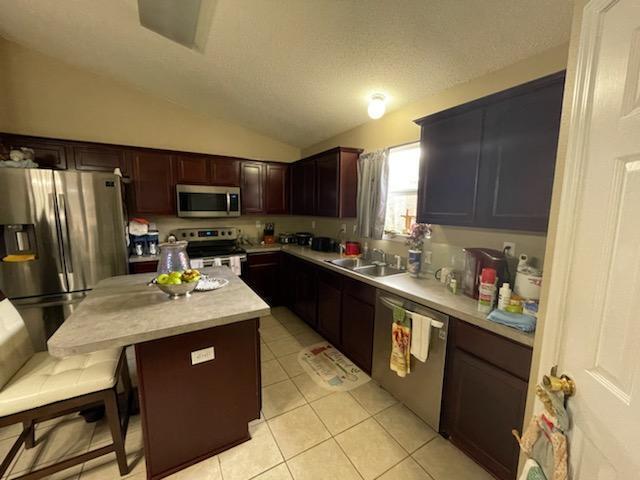 204 Limestone Circle Crestview, FL 32539 - Photo 13 of 19 a kitchen with stainless steel appliances granite countertop a refrigerator stove top oven a sink and dishwasher