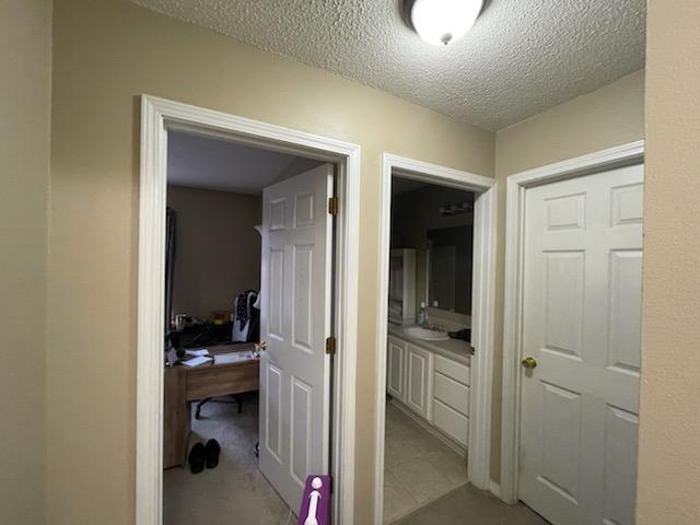 204 Limestone Circle Crestview, FL 32539 - Photo 16 of 19 a en suite bathroom with a sink a mirror and shower