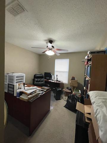 204 Limestone Circle Crestview, FL 32539 - Photo 19 of 19 a bedroom with a bed and a chandelier