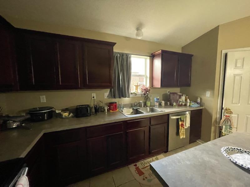 204 Limestone Circle Crestview, FL 32539 - Photo 10 of 19 a kitchen with a sink a stove and cabinets