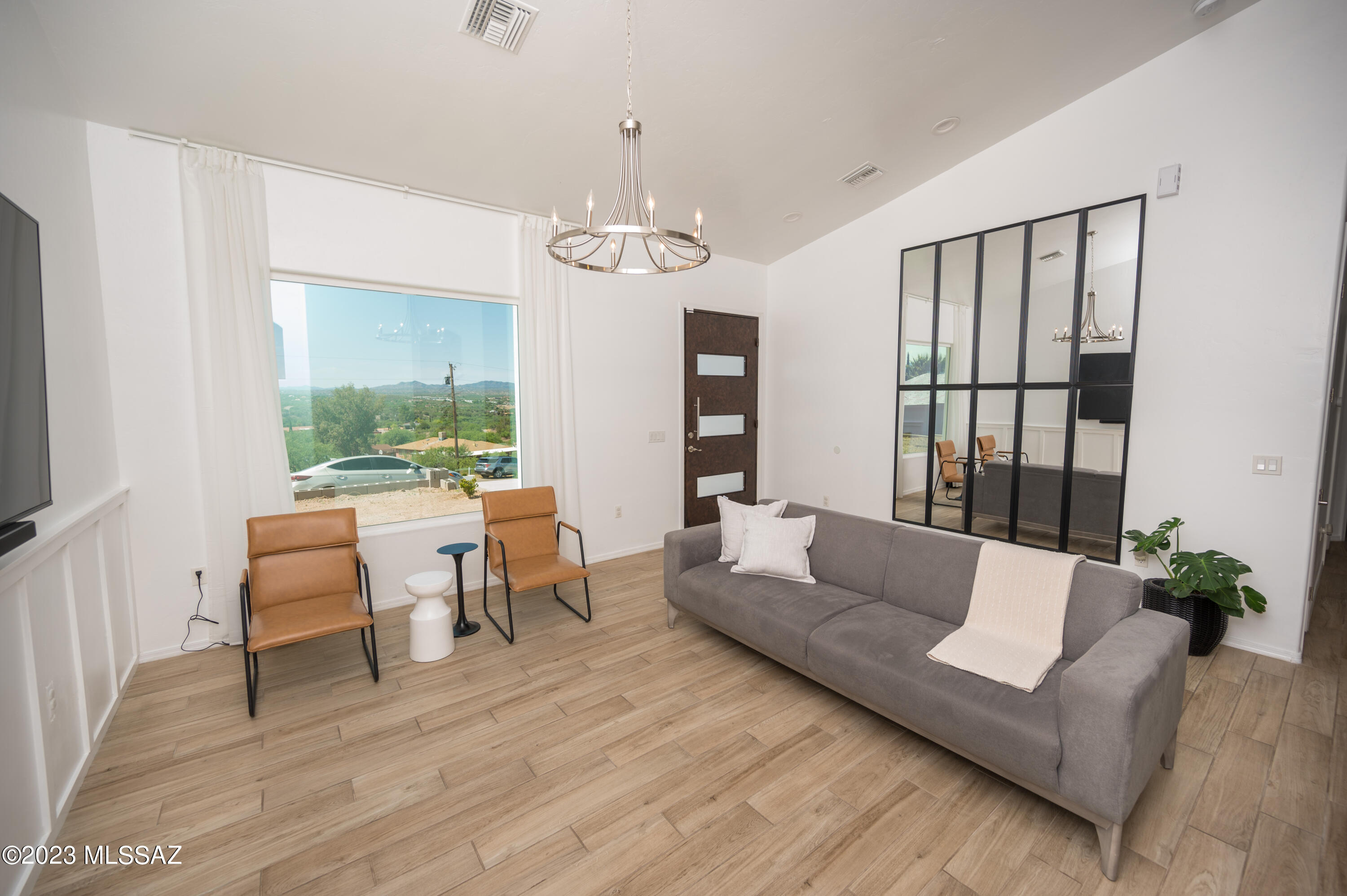 94 Back Nine Terrace Rio Rico, AZ 85648 - Photo 13 of 43 a living room with furniture and a large window