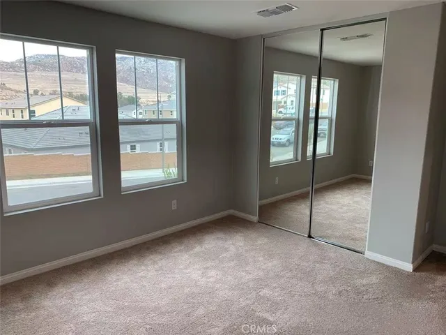 an empty room that has a large window