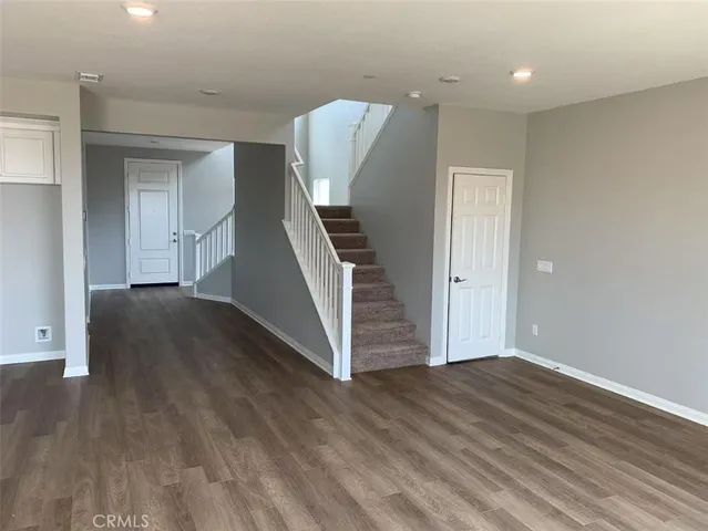 a view of an entryway with wooden floor