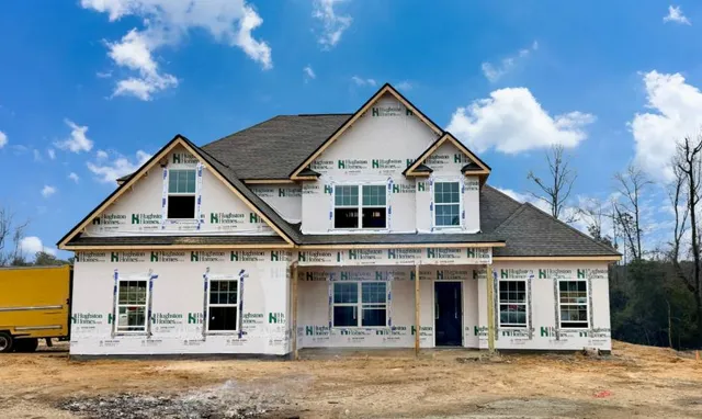 a front view of a house with yard