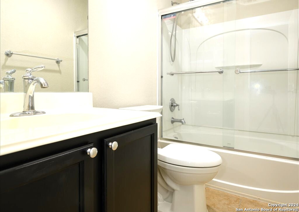 1370 Tractor Pass Schertz, TX 78154 - Photo 14 of 16 a bathroom with a sink a toilet and a mirror