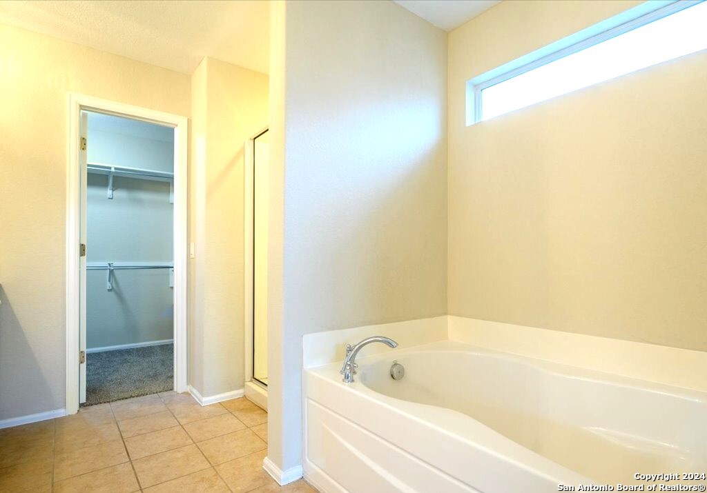 1370 Tractor Pass Schertz, TX 78154 - Photo 8 of 16 a bathroom with a tub and shower