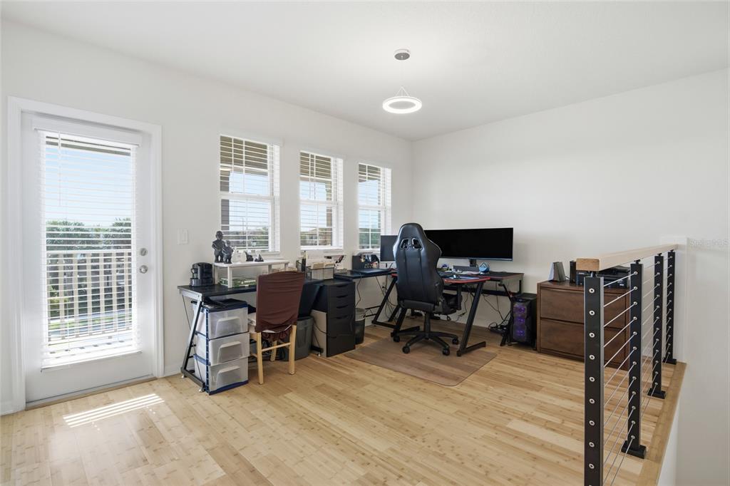 16098 Mangrove Road Winter Garden, FL 34787 - Photo 17 of 40 a view of a workspace with furniture and a window