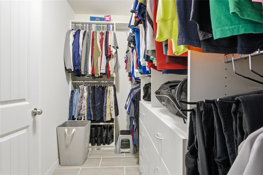 16098 Mangrove Road Winter Garden, FL 34787 - Photo 23 of 40 a view of walk in closet with clothes