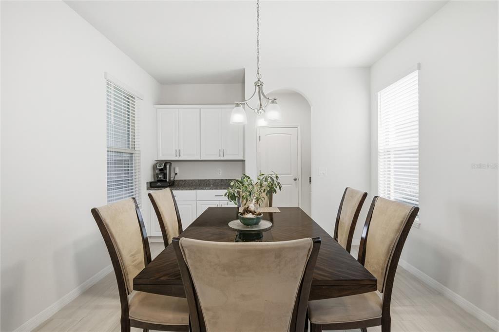 16098 Mangrove Road Winter Garden, FL 34787 - Photo 8 of 40 a dining room with furniture and window