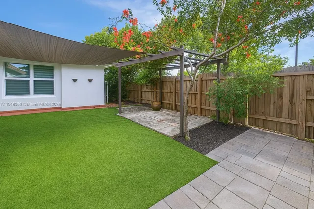 a view of a backyard with a garden