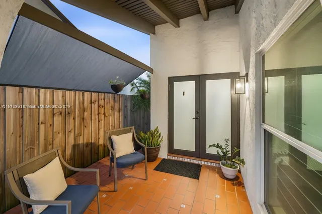 a view of a hallway with furniture and rug