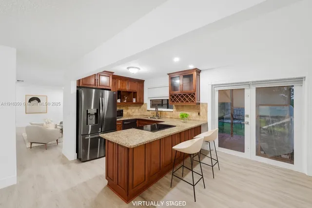 a kitchen with a table and chairs