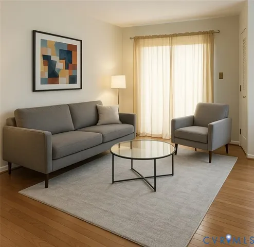 a living room with furniture and a large window