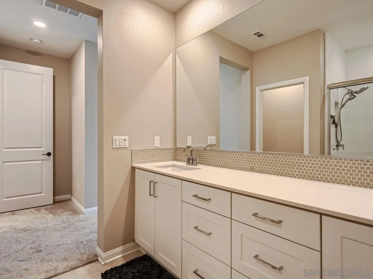 2021 Bluestone Circle Chula Vista, CA 91913 - Photo 11 of 22 a bathroom with a double vanity sink and mirror