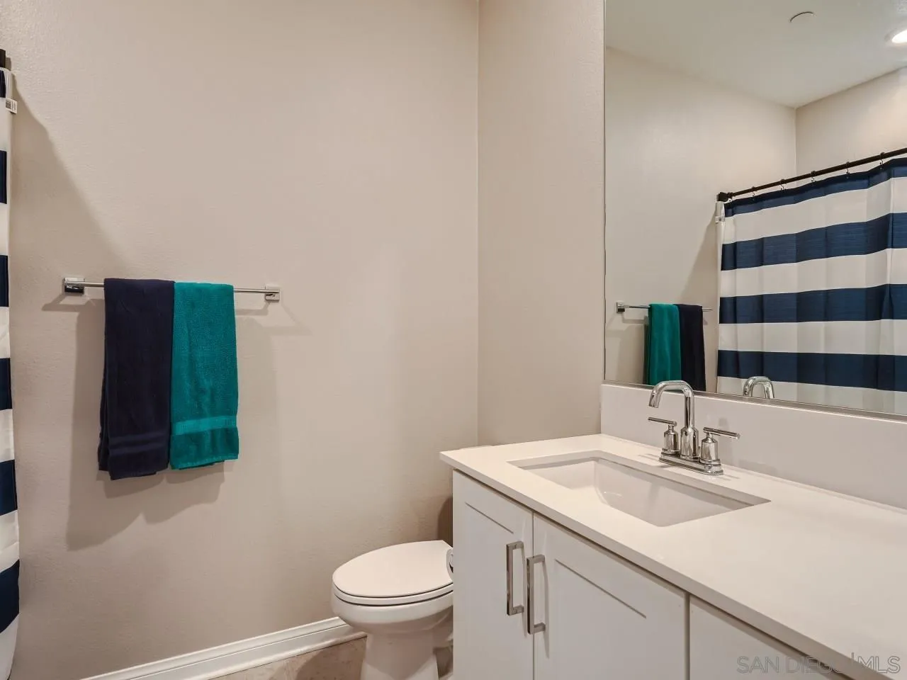 2021 Bluestone Circle Chula Vista, CA 91913 - Photo 17 of 22 a bathroom with a sink toilet and shower