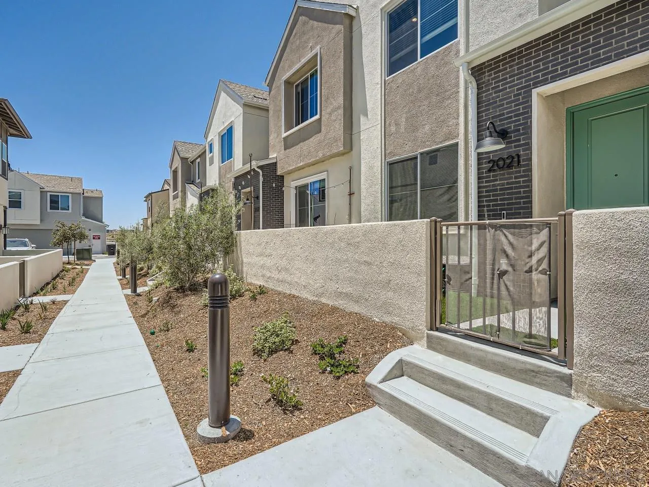 2021 Bluestone Circle Chula Vista, CA 91913 - Photo 4 of 22 a view of a brick building with many windows