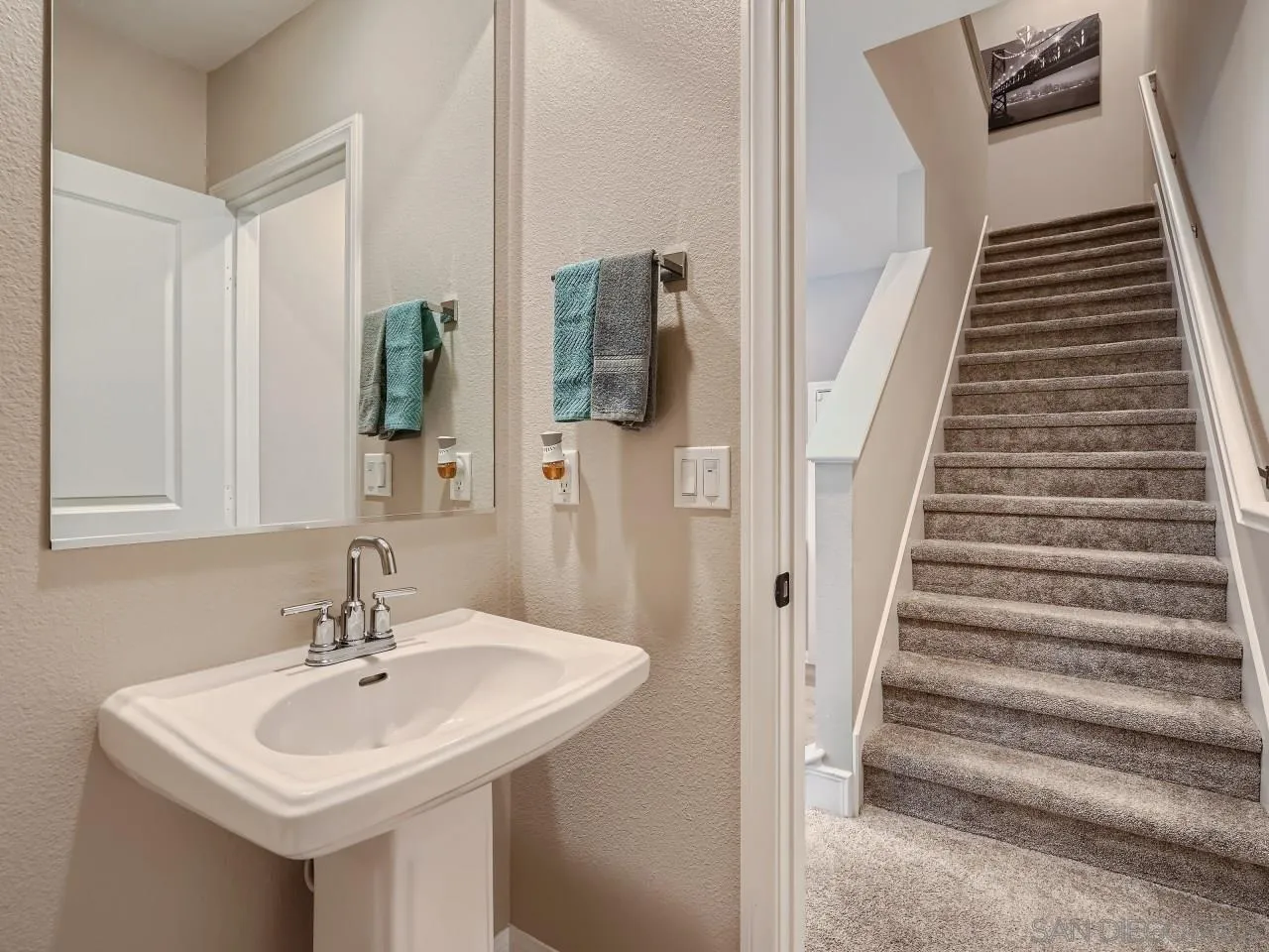 2021 Bluestone Circle Chula Vista, CA 91913 - Photo 9 of 22 a bathroom with a sink and a mirror