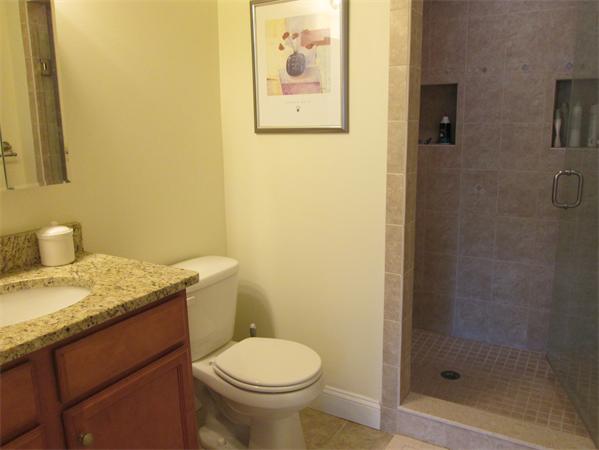 6 B Charles Ridge Road, Unit B Littleton, MA 01460 - Photo 12 of 16 a bathroom with a granite countertop toilet and a sink