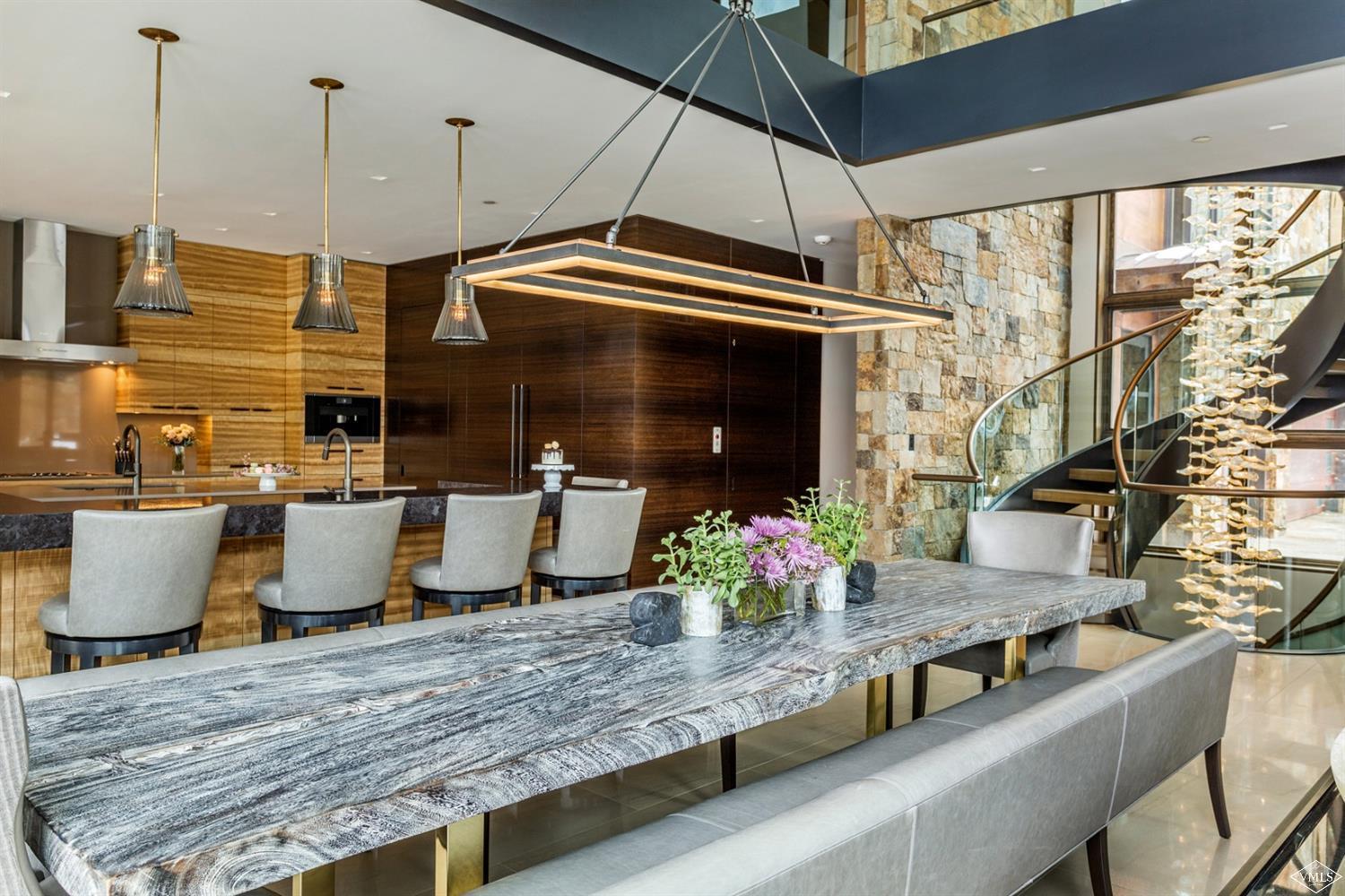 2950 Booth Creek Drive Vail, CO 81657 - Photo 11 of 25 a kitchen with granite countertop a stove and white cabinets