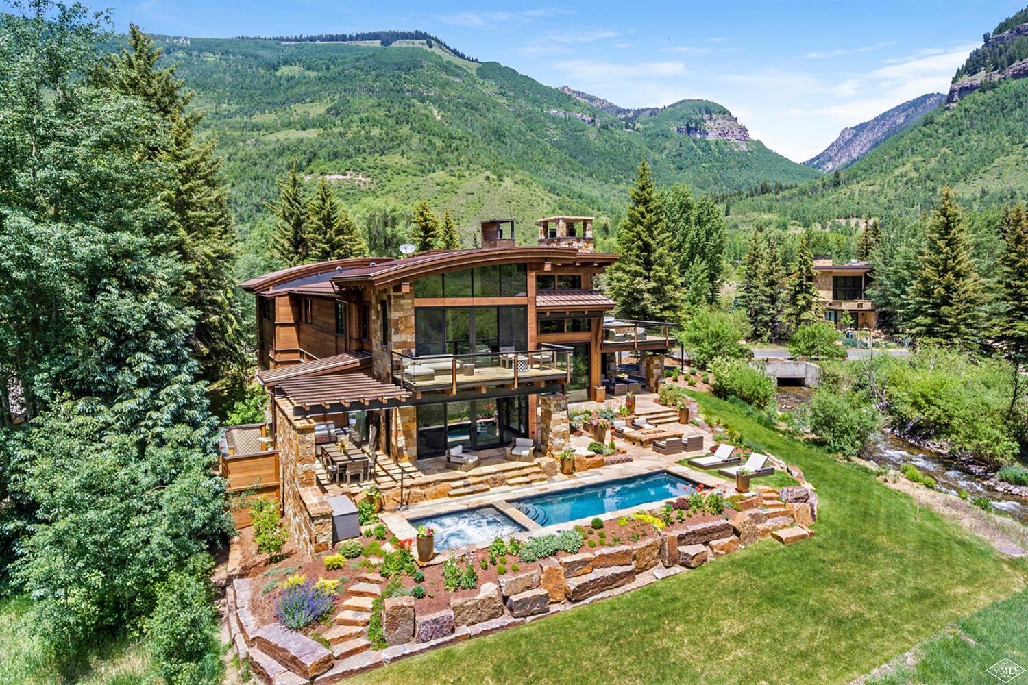 2950 Booth Creek Drive Vail, CO 81657 - Photo 2 of 25 an aerial view of a house with swimming pool a patio