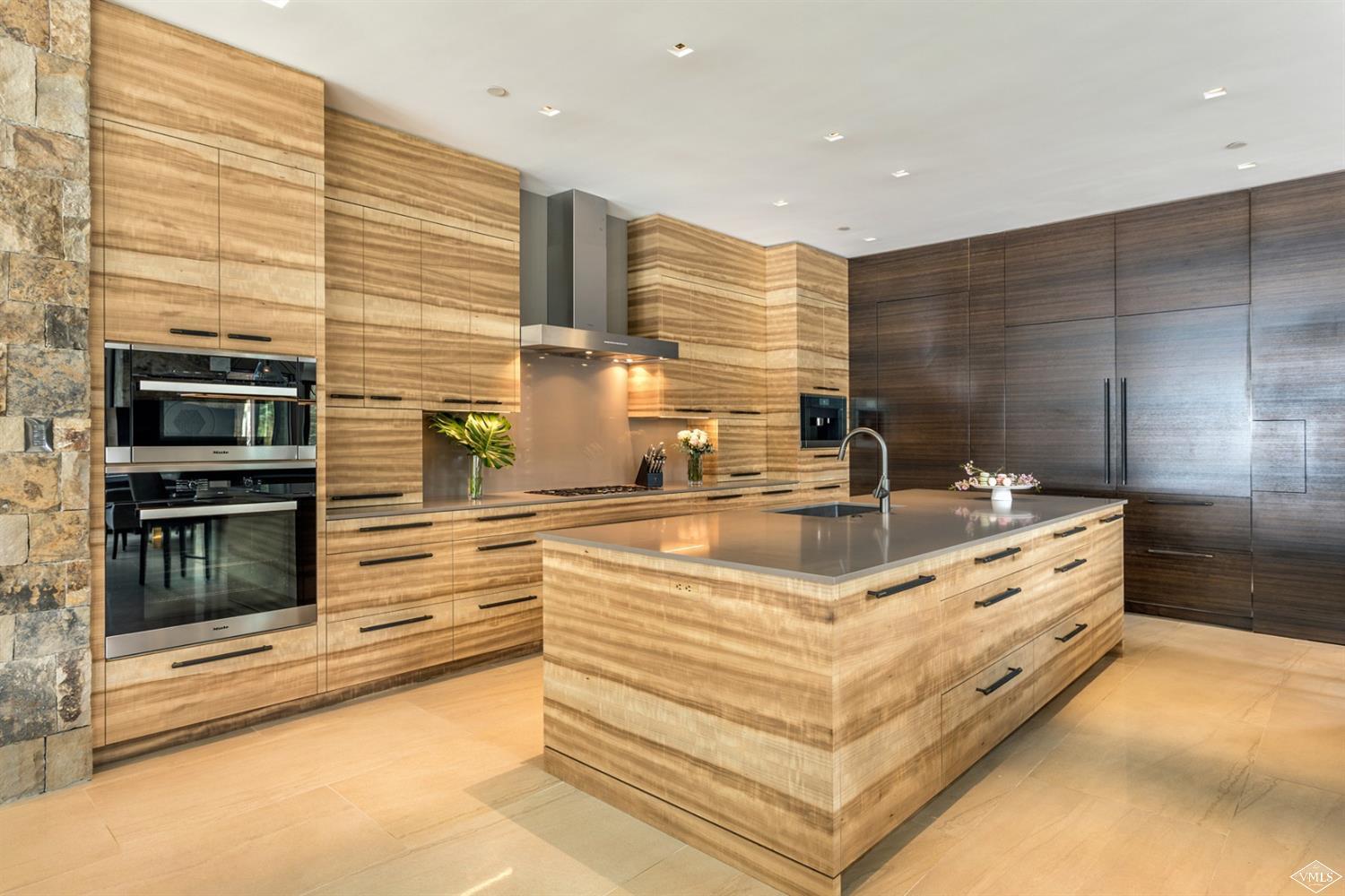 2950 Booth Creek Drive Vail, CO 81657 - Photo 6 of 25 a view of kitchen with stainless steel appliances granite countertop a sink and cabinets