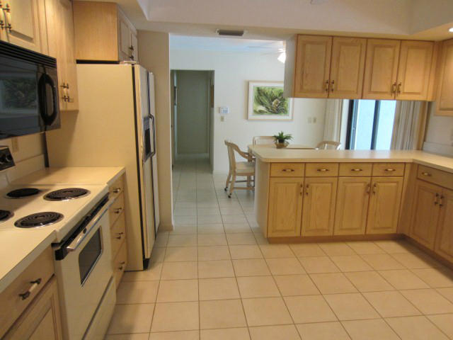 253 Puritan Road West Palm Beach, FL 33405 - Photo 11 of 43 KITCHEN W/VIEW TO EAT IN AREA