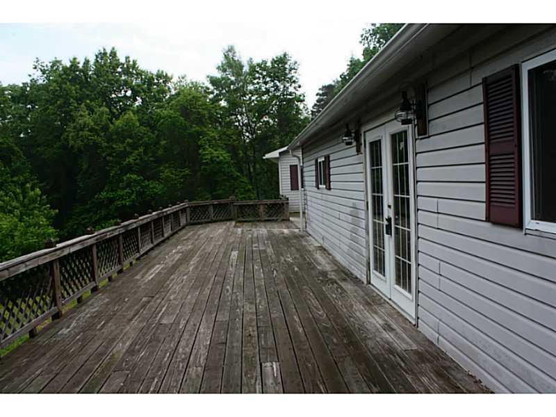 1655 Phillipston Road Rimersburg, PA 16248 - Photo 13 of 21 Patio/Deck. Large wrap around Deck connecting the house and garage.