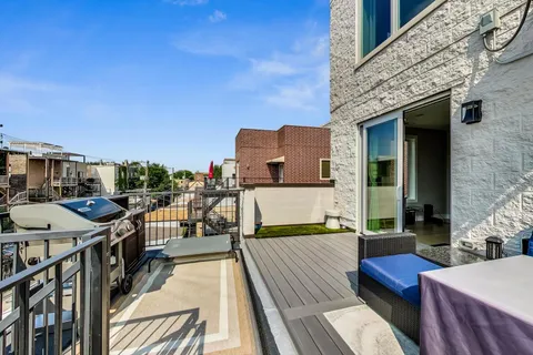 a view of a balcony with chairs