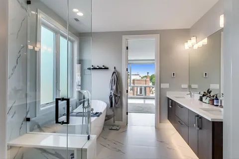 a bathroom with a double vanity sink