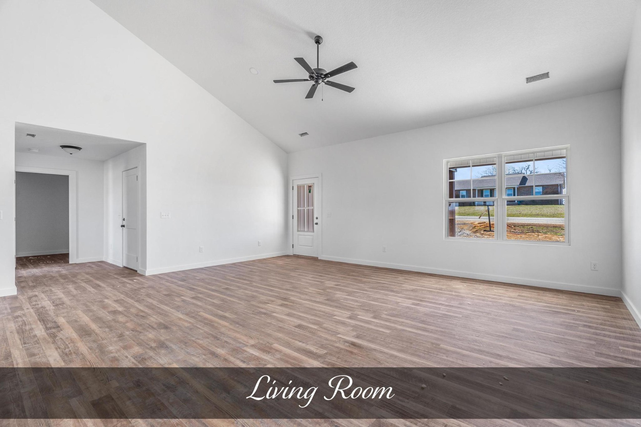 4531 Window Cliff Road Baxter, TN 38544 - Photo 3 of 31 a view of a livingroom with wooden floor and a ceiling fan