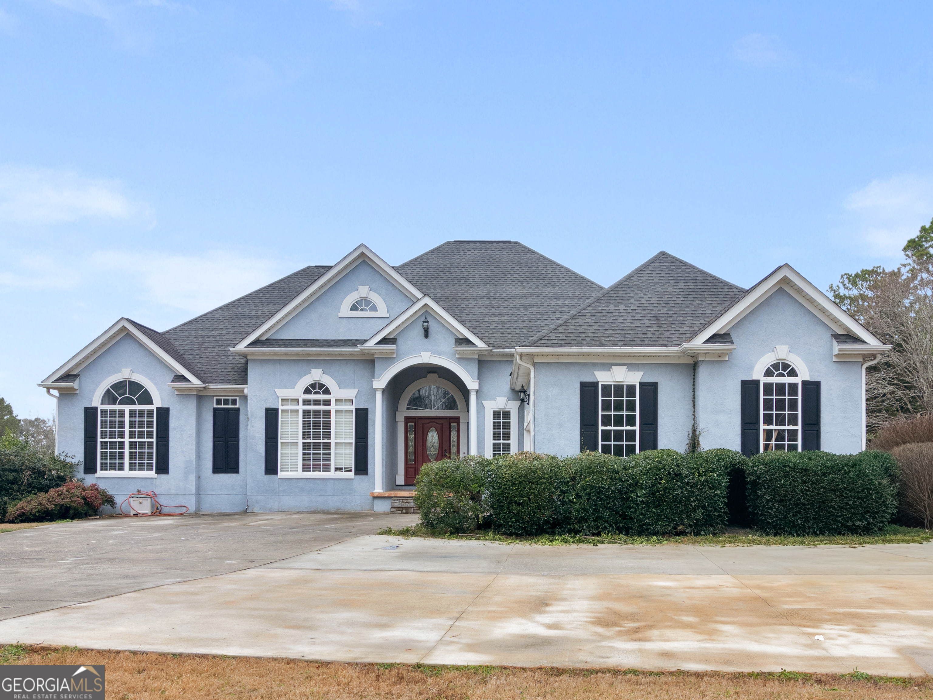 a front view of a house with a yard