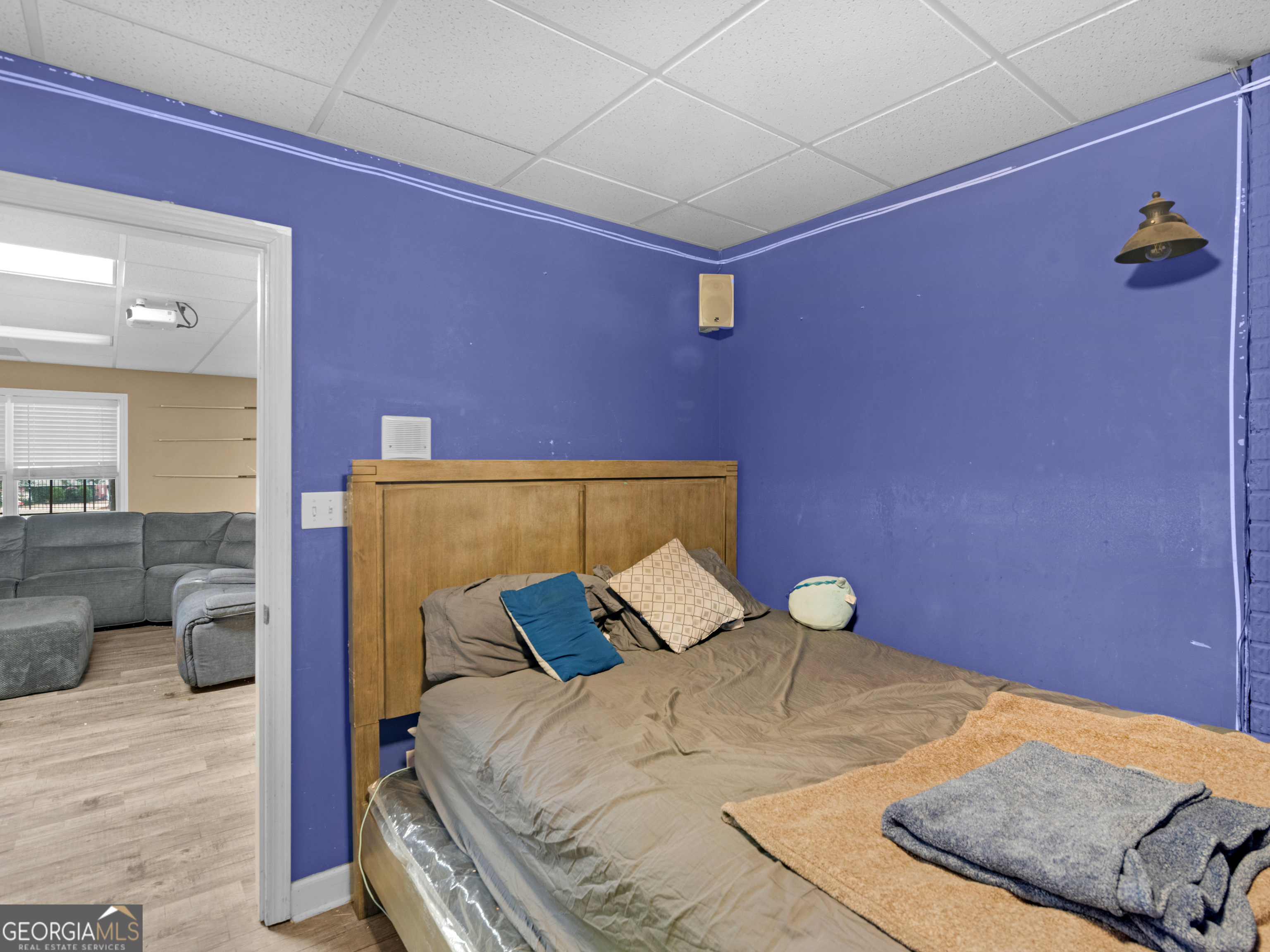 517 North Pine Hill Road Griffin, GA 30223 - Photo 20 of 25 a bed sitting in a bedroom next to a bathroom