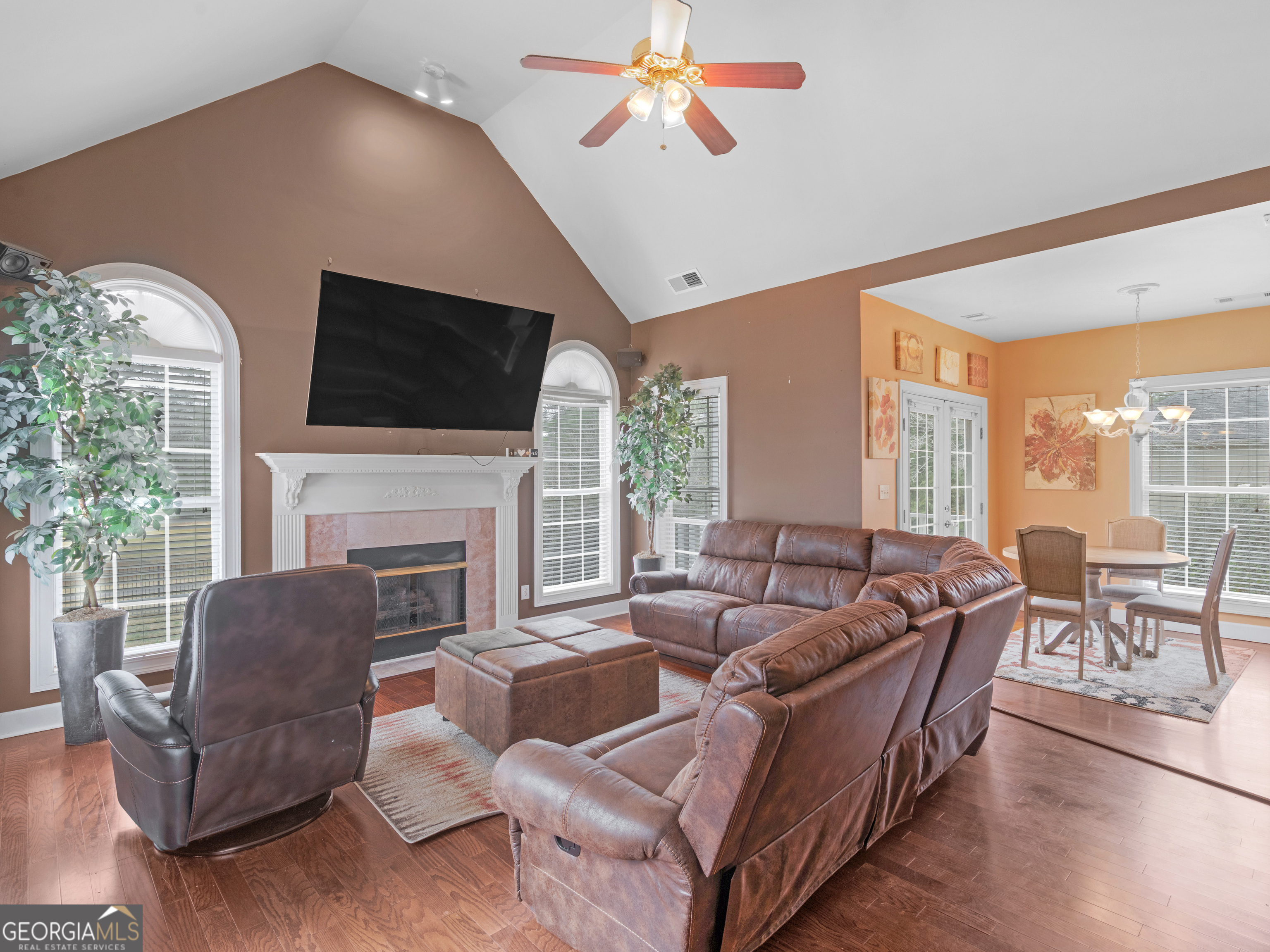 517 North Pine Hill Road Griffin, GA 30223 - Photo 2 of 25 a living room with fireplace furniture and a flat screen tv