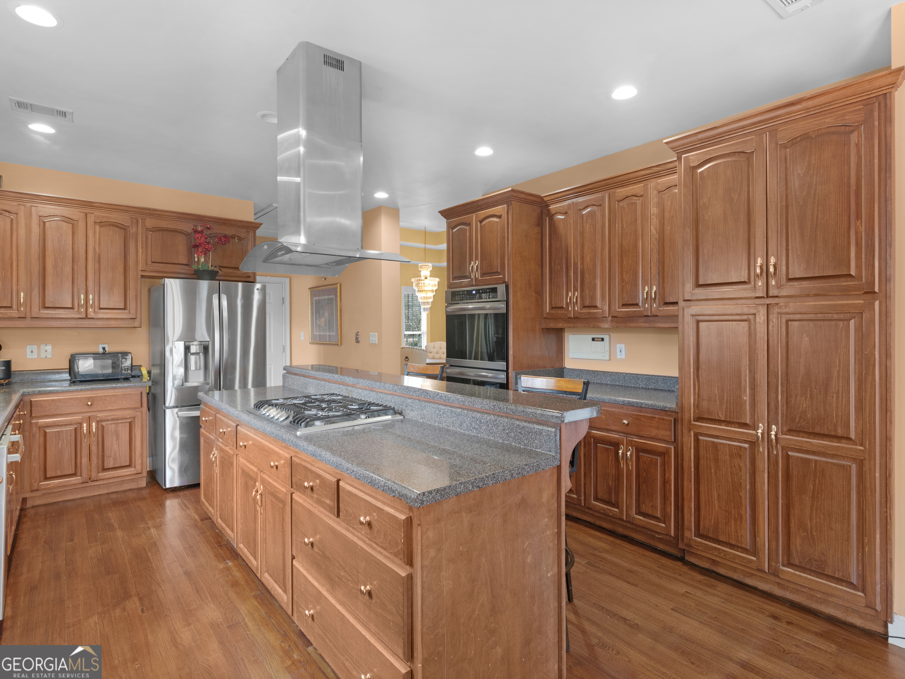 517 North Pine Hill Road Griffin, GA 30223 - Photo 3 of 25 a kitchen with stainless steel appliances granite countertop a stove and a refrigerator