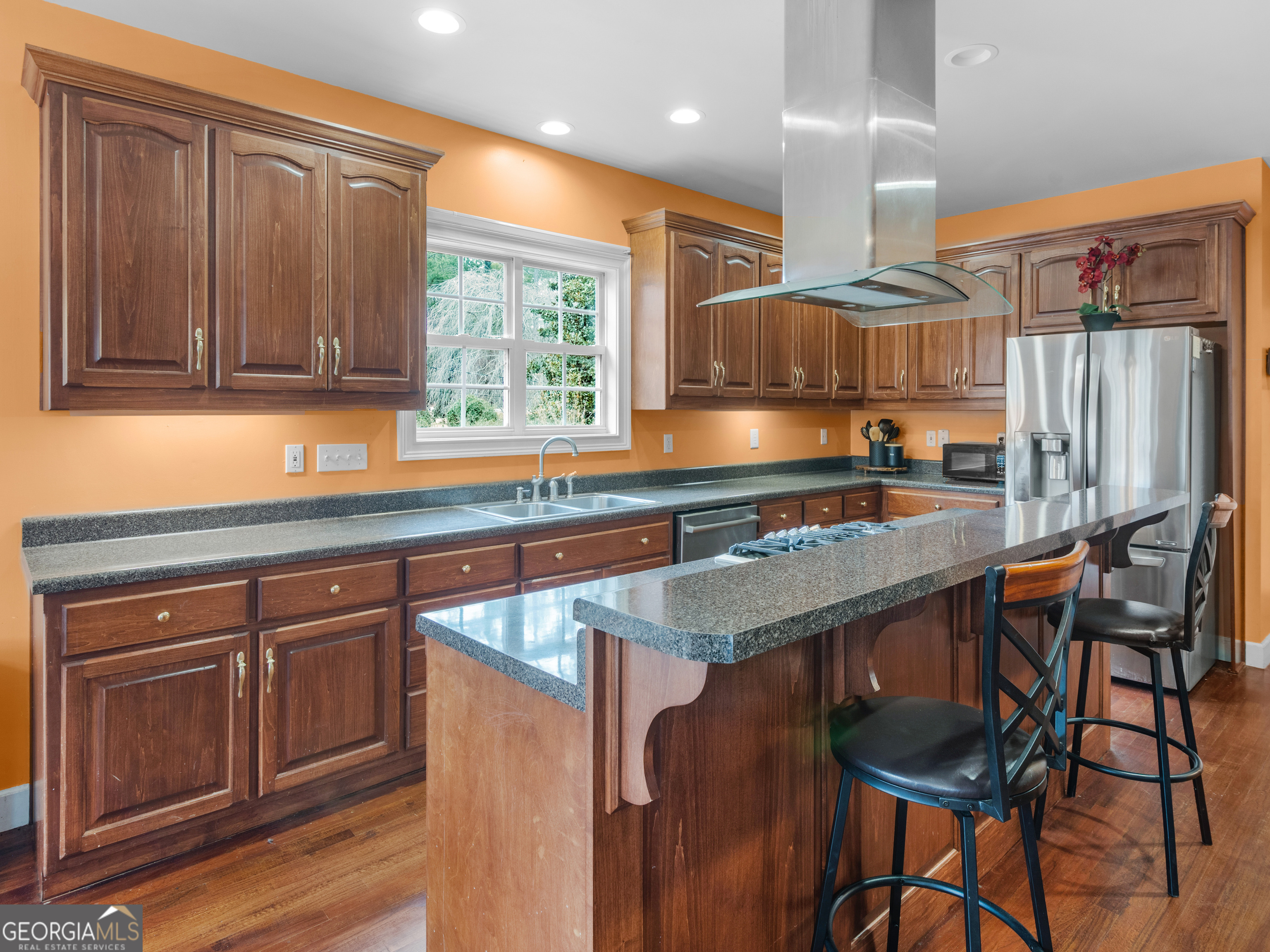 517 North Pine Hill Road Griffin, GA 30223 - Photo 6 of 25 a kitchen with a sink cabinets and window