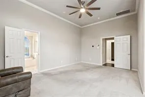 a view of a livingroom with a ceiling fan and window